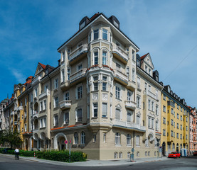 Upper class residential street corner with traditional Bavarian architecture in the centre of Munich on a sunny day