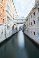 Fototapeta na wymiar Bridge of Sighs and calm water in the canal, nobody in Venice, Italy