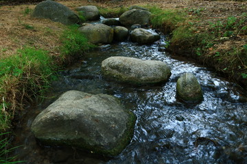 Naklejka na ściany i meble Stone in water