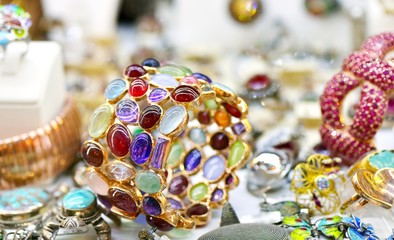 Golden ring with lot of colorful gems