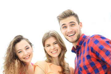 closeup of three young people smiling on white background