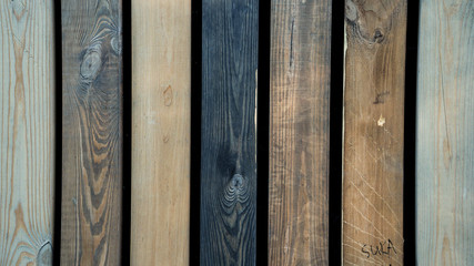 Multicolored wooden wall and blue sky. A colored wall of wood with a lot of copy space. Wooden...