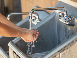 washing hands frequently helps to prevent the spread of germs and bacteria