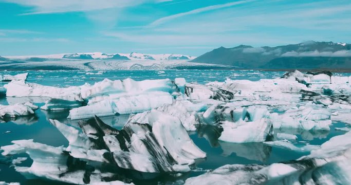  Aerial view of beautiful blue glacier lagoon with giant icebergs in Iceland 