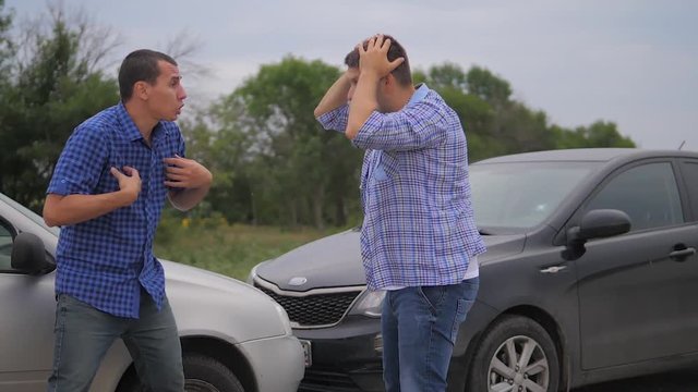 Two men arguing conflict after a car accident on the road car insurance. slow motion video. Two Drivers man Arguing After Traffic Accident. lifestyle auto insurance accident concept men. Two men
