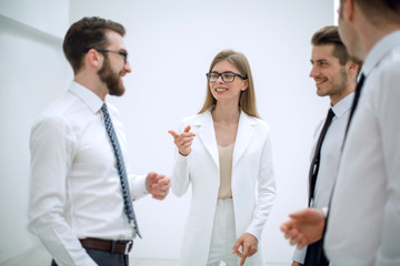 smiling business woman pointing to employee