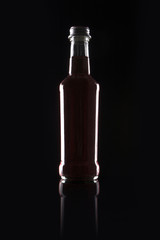 red grape soda bottle on the black