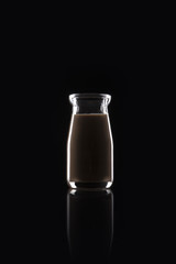 milk coffee bottle on the black