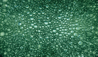 background. defocusing. soapy foam is illuminated with green light
