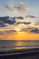 Amazing sea sunset, the sun, waves, clouds