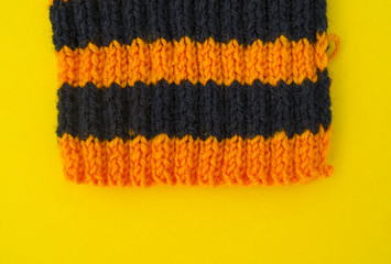 The process of knitting gaiters on a Halloween holiday. Witch costume.