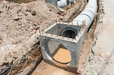 Concrete drainage pipre row on the conctruction work.
