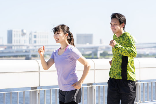young asian couple jogging