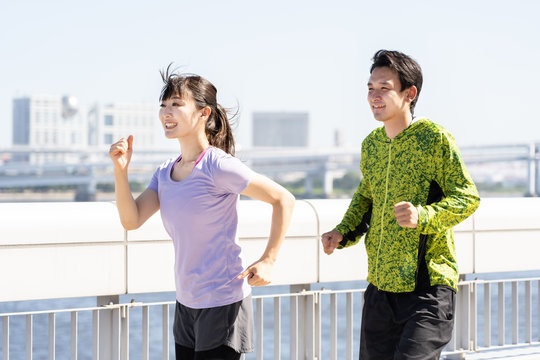 young asian couple jogging