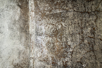 Old grunge wall texture stones and chipped rough background texture.
