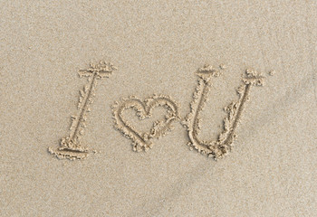 I LOVE YOU .Sand beach background with writing I love you on sand.beach nature background