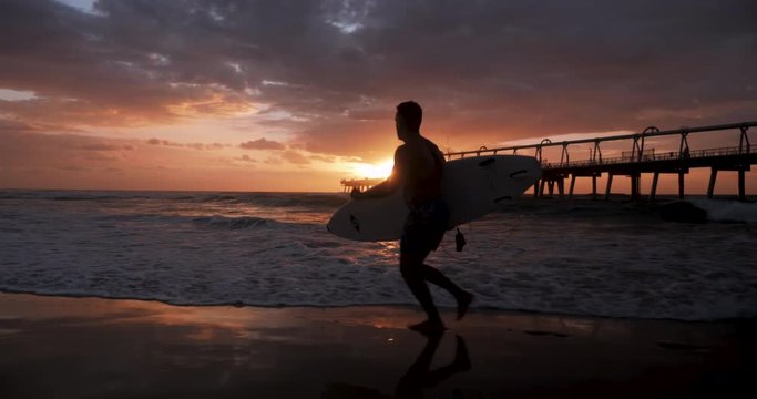 Young Male Surfer Running Sunrise Slow Motion