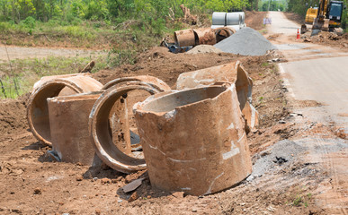 Dirt of Concrete Drainage Pipe on a Construction Site .Concrete pipe stacked sewage water system...