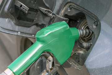 Car refueling on petrol station. Fuel pump with gasoline