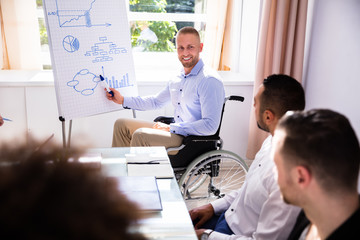 Disabled Businessman Giving Presentation