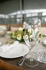 Wedding Banquet or gala dinner. The chairs and table for guests, served with cutlery and crockery. Covered with a linen tablecloth runner. party on terrace