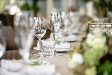 Wedding Banquet or gala dinner. The chairs and table for guests, served with cutlery and crockery....