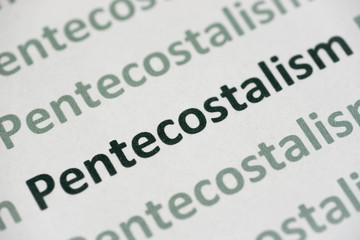 Fototapeta premium word Pentecostalism printed on paper macro