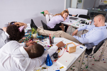 Businesspeople Sleeping In Office