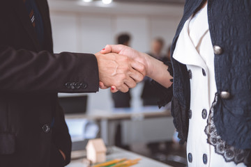 Businessman shake hand together.