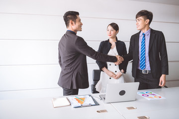 Businessman shake hand together.