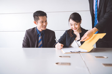 Businessman signing contract document.