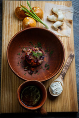 wooden table topped with plates of traditional ukrainian food