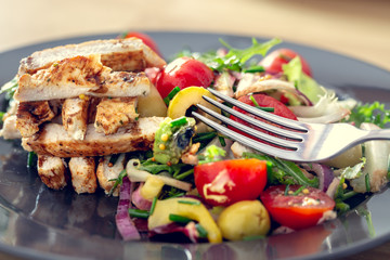 Grilled chicken salad and vegetables. Dietetic healthy food.