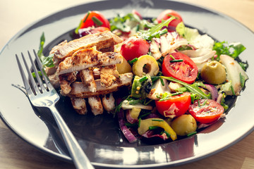Grilled chicken salad and vegetables. Dietetic healthy food.