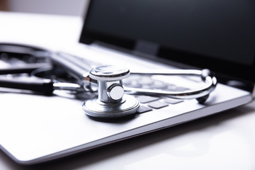 Close-up Of Stethoscope And Laptop
