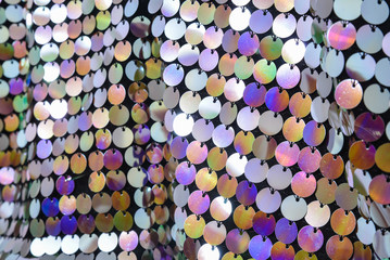 Obraz na płótnie Canvas Texture of color pearlescent sequins, macro photo