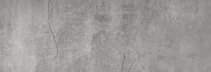graue glatte Betontextur mit charaktergebenden Rissen und Strukturen in XXL als Hintergrund