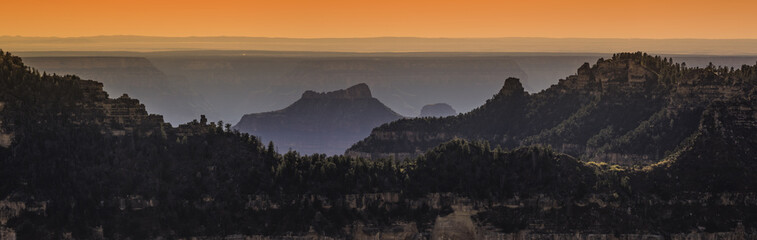 panorama of the mountain peaks north side Grand Canyon at sunset