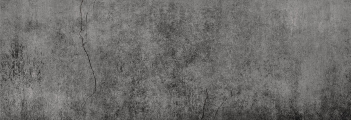 Textur einer fast schwarzen Betonwand mit leichten Rissen in XXL-Größe als Hintergrund, auf die...