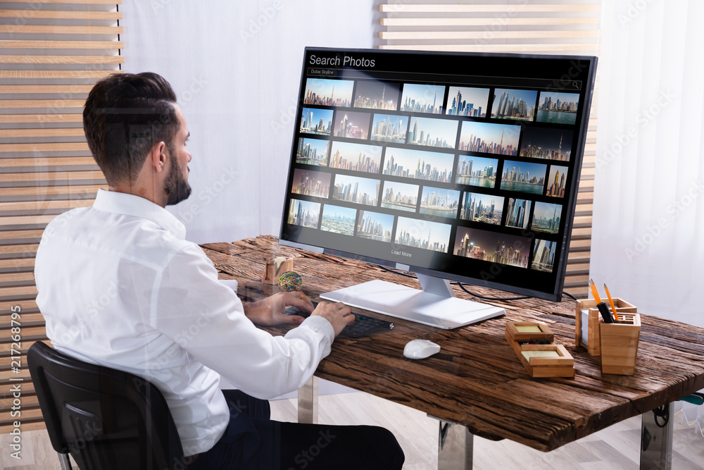Poster photo editor searching photos on computer