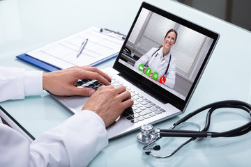 Doctor Video Conferencing On Laptop