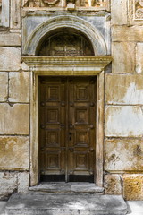 Fototapeta na wymiar Wooden door in a Greek Church