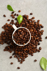 Coffee beans in espresso white cup