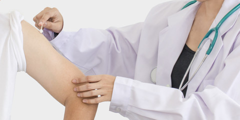 Young doctor woman inject a man.He looking to worry on white background.Copy space.