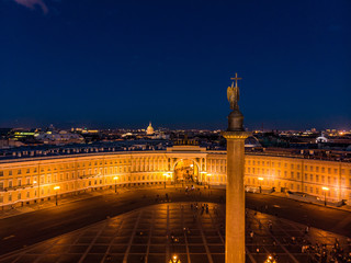 Fototapeta na wymiar Aerial front view at the General staff and arc de Triomphe building in white nights, exterior Palace Square and Aleksandr Column at summer. Top view from drone. Saint-Petersburg, Russia