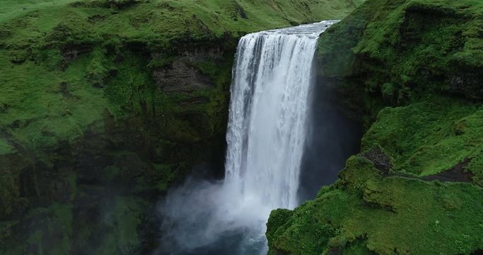 Aerial view close up of amazing giant large powerful waterfall flowing in Iceland 