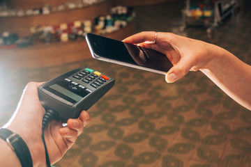 Terminal and smartphone during payment by NFC