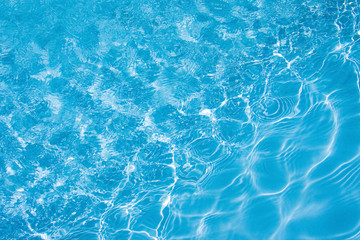 The texture of blue water that sparkles in the sun_