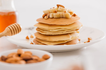 banana cashew pancakes with bananas and salted caramel sauce. the toning. selective focus