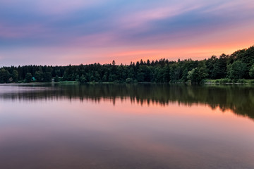Fototapeta na wymiar Pond at amazing sunset in summer landscape